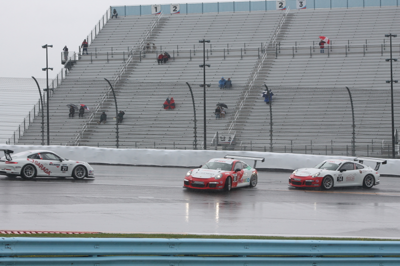 Illustration for article titled Standing Water Causes Mass 911 GT3 Cup Spin-Out At First Turn Of Race